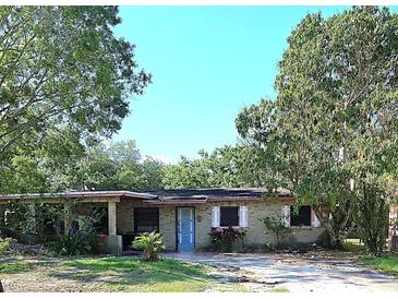 Charming single-story home with a front porch and mature shade trees at 5262 Lescot Ln, Orlando, FL 32811