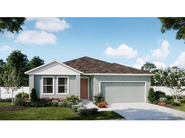Charming single-story home with a two-car garage, neutral color palette, and well-manicured landscaping at 742 Ginger Dr, Haines City, FL 33844