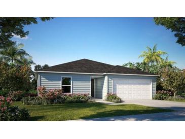 Charming single-story home features a two-car garage, manicured lawn, and lush landscaping at 103 Orchid Ct, Poinciana, FL 34759