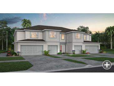 Beautiful two-story home showcasing a manicured lawn, multi-car garage and impeccable modern design at 2582 Winsome Way, Davenport, FL 33896
