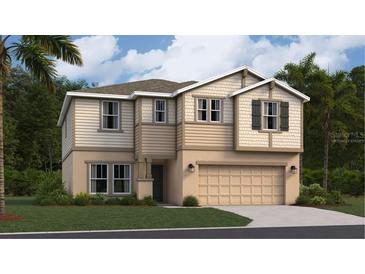 Charming two-story home featuring a two-car garage, manicured lawn, and stylish tan and beige siding at 459 Puma Loop, Groveland, FL 34736