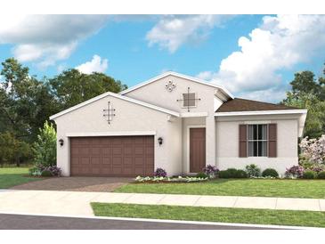 Inviting single-Gathering home with a two-car garage and a well-manicured lawn at 940 Club Cresswind Dr, Lady Lake, FL 32159