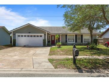 Charming single-story home featuring a two-car garage and a well-maintained front yard at 978 N Jerico Dr, Casselberry, FL 32707