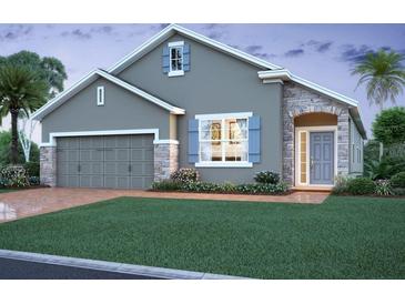 Charming single-Gathering home with a well-manicured lawn and stone accents, creating an inviting curb appeal at 2631 Great Heron Ave, St Cloud, FL 34773