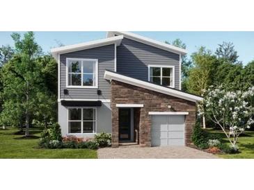 Charming two-story home with modern design and well-maintained landscaping at 7876 Marlow Pl, Kissimmee, FL 34746