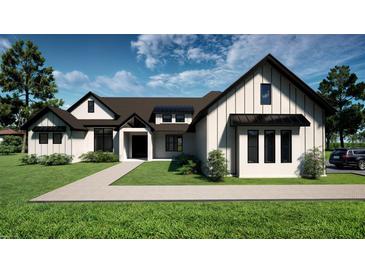 Stunning home featuring a modern design with a lush green lawn and beautiful landscaping at 9940 Black Bear Ln, Winter Garden, FL 34787