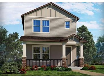 Charming two-story home featuring a welcoming front porch, stone accents, and beautifully landscaped front yard at 16526 Silver Brook Way, Winter Garden, FL 34787