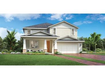Charming two-story home featuring a well-maintained lawn, front porch and an attached two-car garage at 2521 Cedar Rose St, Apopka, FL 32712