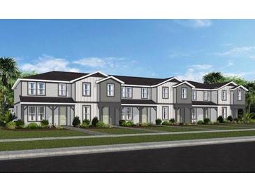Attractive townhome with a landscaped front yard and neutral color palette at 4564 Maple Waltz Aly, Clermont, FL 34714