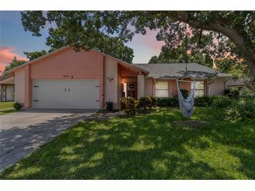Charming single-Gathering home with a well-maintained lawn, mature trees, and inviting curb appeal at 4930 Gifford Blvd, Orlando, FL 32821