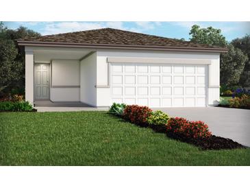 Charming single-story home with a clean white exterior, attached garage, and well-manicured front lawn with colorful shrubs at 1125 Cumberland Trail Dr, Lake Hamilton, FL 33851