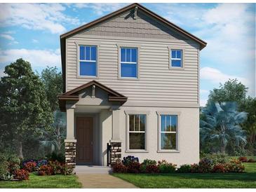 Charming two-story home featuring stone accents, stylish siding and inviting covered entry at 16448 Silver Brook Way, Winter Garden, FL 34787