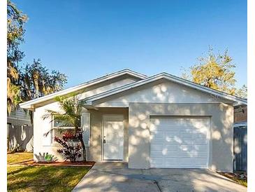 Charming single-story home with a well-maintained lawn and attached one car garage and neutral paint at 3347 Timberline W Rd, Winter Haven, FL 33880