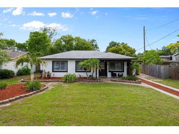 Charming single-story home with a well-manicured front yard and decorative landscaping at 6 S Lakewood Dr, Orlando, FL 32803