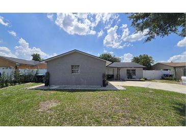Charming single-story home featuring a well-manicured lawn and brick exterior, perfect for suburban living at 6152 Roxburg Ave, Orlando, FL 32809