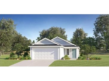 Charming single-story home with a well-maintained lawn, attached garage, and blue accent door at 3226 Ne 35Th Pl, Ocala, FL 34479