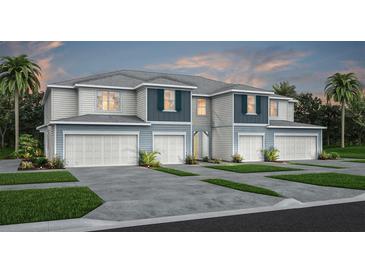Charming townhome with manicured lawn, private driveways, and appealing two-story facade at 3610 Raindrop Way, Sanford, FL 32773