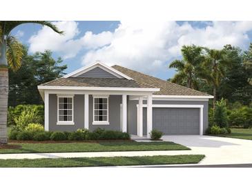 Beautiful one-story home featuring a two-car garage, neutral paint and a well-manicured lawn at 5706 Cattle Ranch Drive, St Cloud, FL 34771