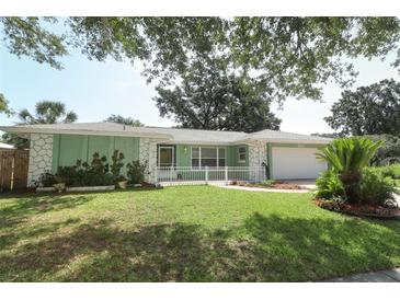 Charming single-story home with a manicured lawn and inviting curb appeal at 645 Peachwood Dr, Altamonte Springs, FL 32714