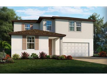 Charming two-story home with a two-car garage and a well-manicured lawn with colorful flower beds at 1140 Cumberland Trail Dr, Lake Hamilton, FL 33851
