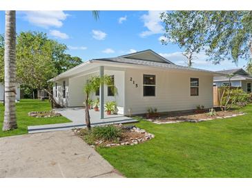 Charming single-story home with well-manicured lawn and inviting curb appeal at 215 Bradbury Ave, Oak Hill, FL 32759