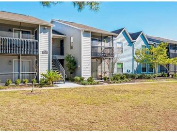 Condo exterior features multiple units, well-maintained landscaping, and ample open space at 3772 Idlebrook Cir # 100, Casselberry, FL 32707