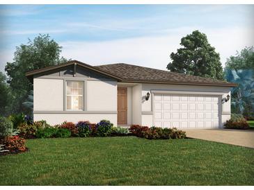 Charming single-story home featuring a well-manicured lawn and a two-car garage at 4537 Windy Oak Way, St Cloud, FL 34772