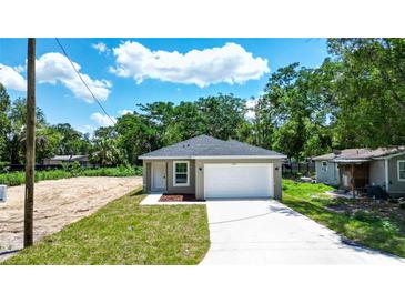 Charming single-story home with a well-maintained lawn and attached one car garage at 2260 Suanne Ave, Eustis, FL 32726