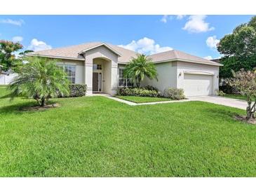 Charming single-story home with well-manicured lawn and lovely landscaping at 236 Boxwood Dr, Davenport, FL 33837
