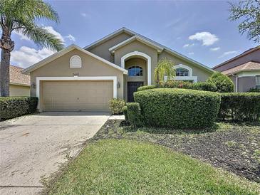 Charming single-Gathering home featuring a well-manicured front yard and a two-car garage, ideal for comfortable living at 2641 Hemingway Ave, Haines City, FL 33844