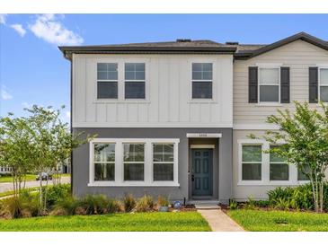 Charming two-story home featuring a well-manicured lawn and modern architectural details at 3206 Water Sprite St, Orlando, FL 32808