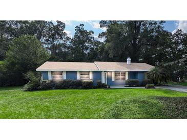 Charming single-story home with well-maintained lawn and traditional architecture at 2928 Ne 14Th Ave, Ocala, FL 34479