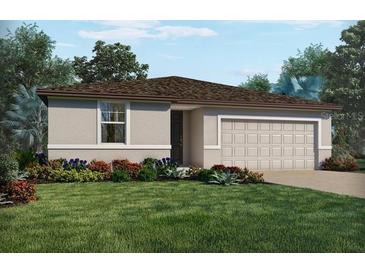 Charming one-story home boasts a well-manicured lawn, colorful flowerbeds, and a convenient two-car garage at 1336 Oak Valley Dr, Auburndale, FL 33823