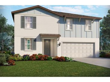Charming two-story home featuring a two-car garage and beautifully landscaped front yard at 2122 Rosewood Dr, Bartow, FL 33830