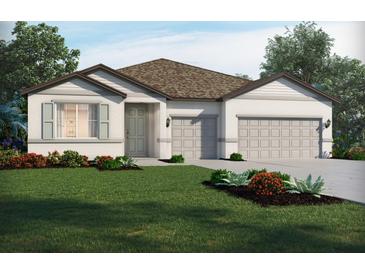 Charming single-story home featuring a two-car garage, neutral color palette, and well-maintained landscaping at 2364 Citrus Bloom Dr, Bartow, FL 33830
