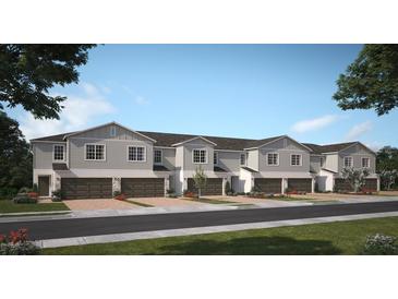 Charming townhomes feature attached garages, manicured landscaping, and a welcoming neighborhood appeal at 2521 Starry Pt, St Cloud, FL 34769
