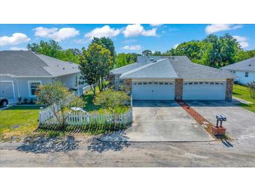 Charming home featuring a well-maintained yard, inviting curb appeal, and a spacious two-car garage at 1115 S Mary St, Eustis, FL 32726