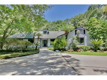 Charming single-story home with well-maintained landscaping and mature trees at 183 Parsons Rd, Longwood, FL 32779