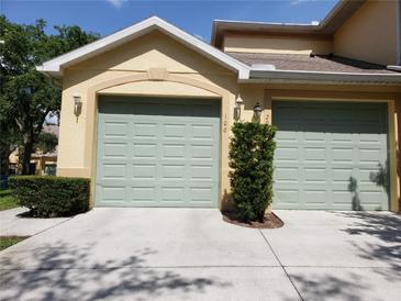 A two-car garage offers convenient parking and storage at 3658 Oakdale Cir # 100, Oviedo, FL 32765