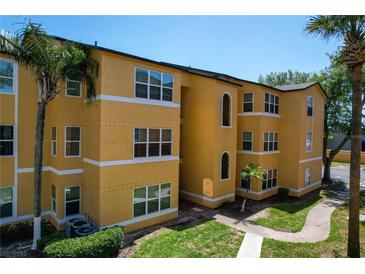 Lovely three-story building with well-maintained landscaping and ample natural light at 4528 Commander Dr # 2033, Orlando, FL 32822