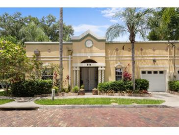 Charming single-story home with lush landscaping, palm trees, and a welcoming entrance at 548 S Hyer Ave # 1, Orlando, FL 32801