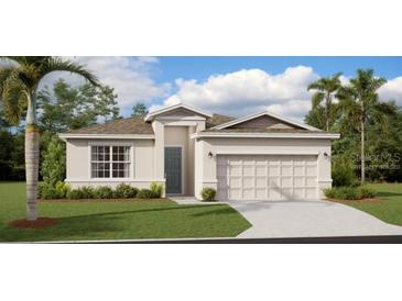 Well-maintained single-story home with a two-car garage, manicured lawn, and lush landscaping at 2234 Crown Rock Dr, Haines City, FL 33844