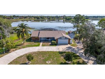 A charming single-story house is perfectly situated on a picturesque lakefront property, offering serene water views at 2562 Sheffield Dr, Deltona, FL 32738
