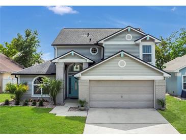 Charming two-story home featuring a well-maintained lawn and inviting front entrance at 485 Whittingham Pl, Lake Mary, FL 32746