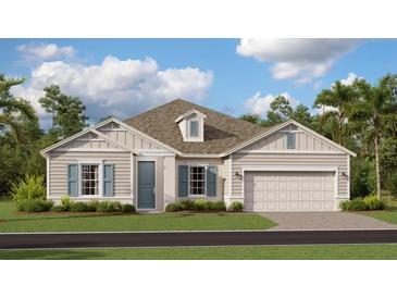 Charming one-story home with neutral siding, blue shutters and a well-manicured lawn at 809 Tundra Loop, Groveland, FL 34736