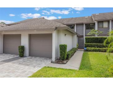 Charming townhome with a well-manicured lawn, attached garages and beautiful curb appeal at 148 Olive Tree Cir # 148, Altamonte Springs, FL 32714