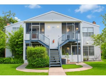 Inviting two-story exterior showcasing well-maintained landscaping and screened-in patios, perfect for relaxing outdoors at 1108 Northlake Dr # 1108, Sanford, FL 32773