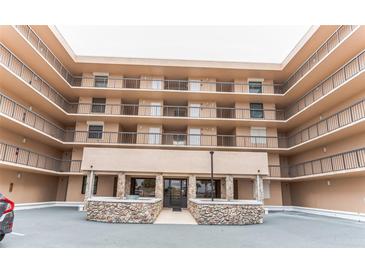 Attractive multi-story building with stacked balconies and stone accents at the entrance at 3360 Ocean Shore Blvd # 4050, Ormond Beach, FL 32176
