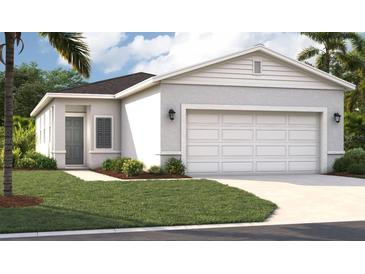 Charming one-story home featuring a well-maintained lawn, a two-car garage, and a modern design at 4125 Lavender Ct, Lake Hamilton, FL 33851