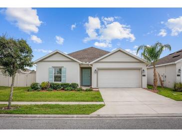 Charming single-story home with a two-car garage, well-maintained lawn, and appealing curb appeal at 601 Watusi Way, St Cloud, FL 34772